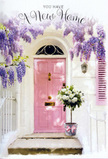 This tender doorway composition evokes the quiet excitement of a move into a new Golders Green home, captured in soft colour and thoughtful detail. At the centre stands a pale pink front door, its blush tone glowing gently against the surrounding whitewashed wall, much like the subtly painted entrances you might pass on a stroll between Golders Green and Brent Cross. The surface of the door catches light in a calm, even way, hinting at a late afternoon sun that has begun to soften. Overhead, wisteria cascades in loose, lavender-tinted curtains, its elongated clusters of flowers spilling downward in an easy, natural arc. The vines twist and meander, forming a romantic canopy that frames the doorway and casts whisper-light shadows across the façade. A single shutter, brushed in the same rosy shade as the door, rests alongside, tying the colour story together and adding a hint of symmetry. On the doorstep itself sits a grey tin bucket, simple and unpretentious, overflowing with lush white and cream roses. The blooms are full and velvety, each petal curving outward like folded silk, supported by glimpses of soft green foliage that punctuate the pale flowers. A narrow pink ribbon is gently knotted around the bucket's base, its sheen catching the light and echoing the pastel accents of the woodwork. You can almost imagine the cool touch of the metal, the faint rustle of petals as the door opens, and the mingling scents of fresh roses and wisteria drifting onto a quiet Golders Green pavement. The overall mood is one of quiet hope, heartfelt congratulations, and the comforting sense that this doorway will soon become a familiar, much-loved part of everyday life.